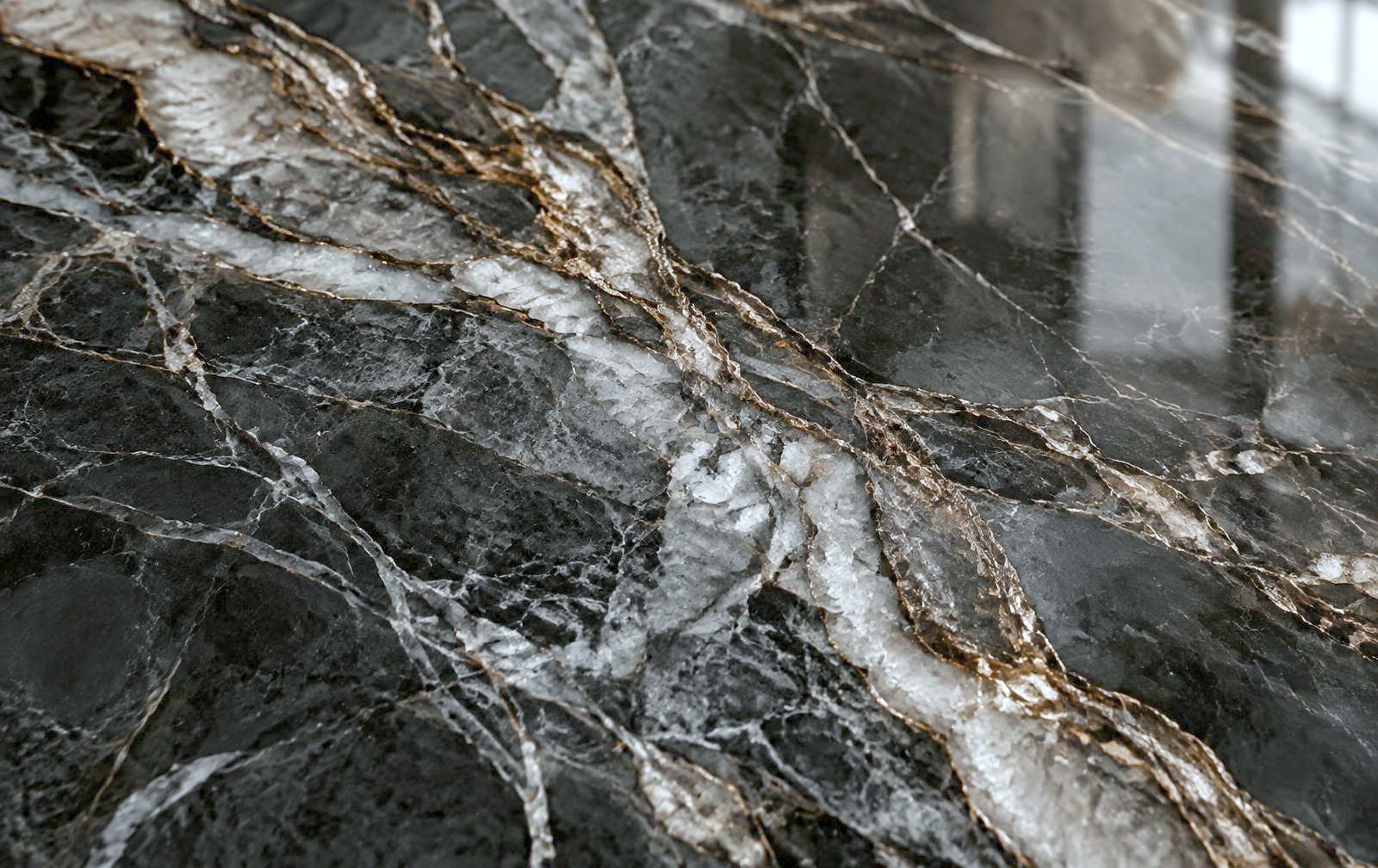 Close-up of polished quartzite with grey and bronze veining